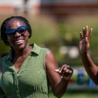 Two women dancing to live music
